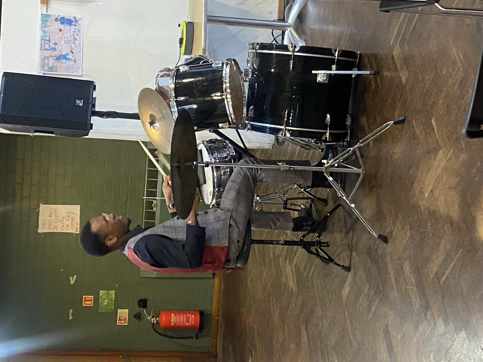A drummer playing during worship