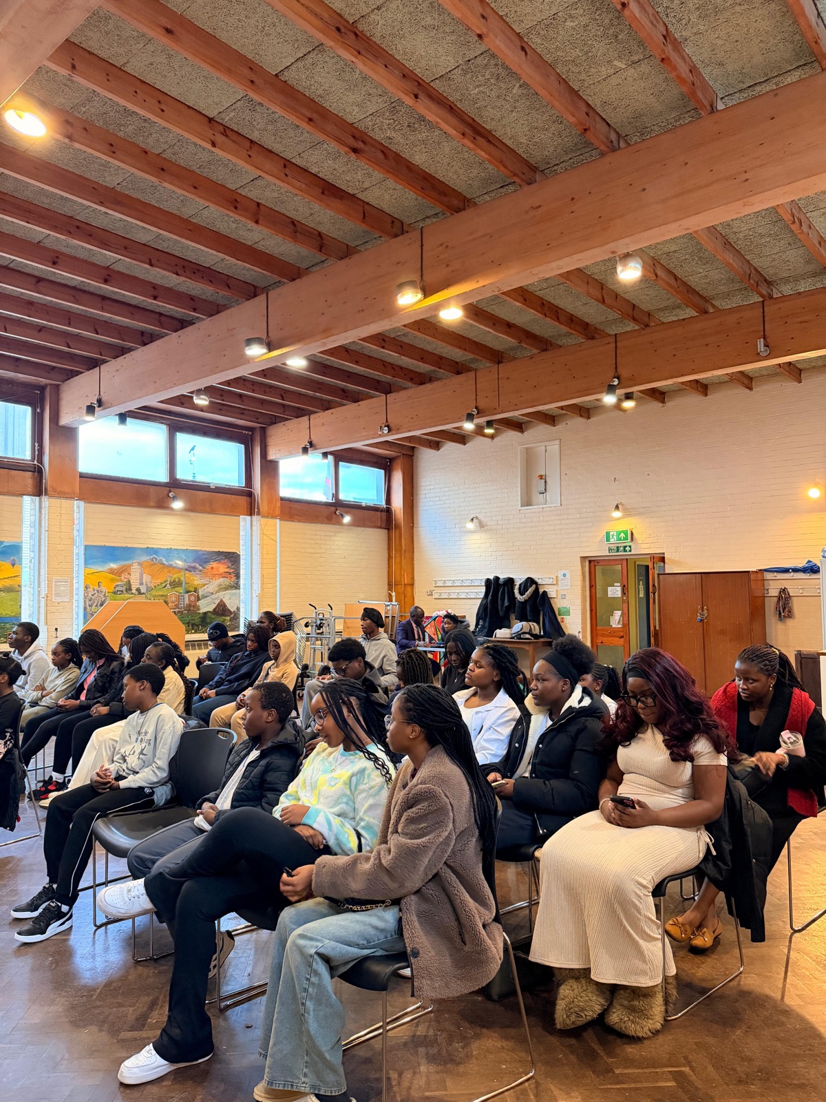 Young people seated together listening during a Sunday service